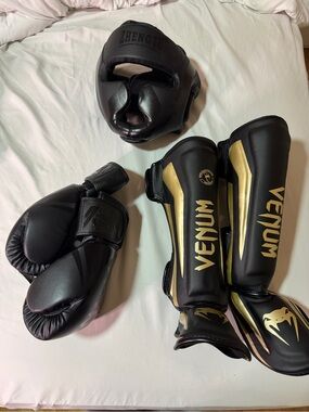 Venum Black & Gold Shin Guards with Matching Black Headgear and Gloves